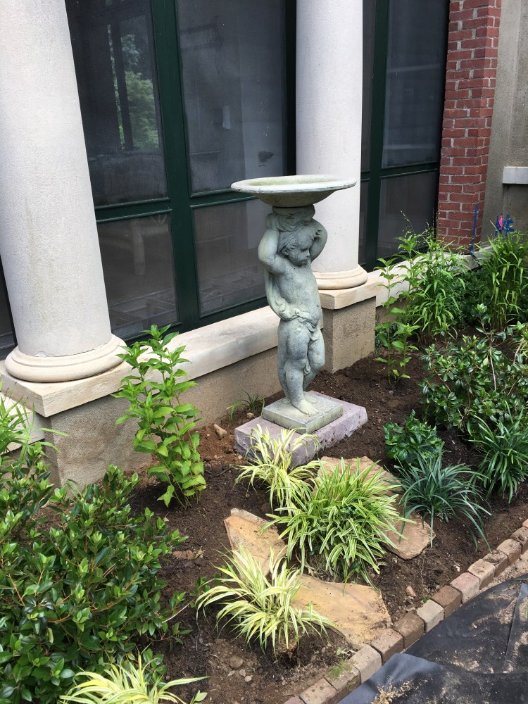 Garden statue: boy with bird bath