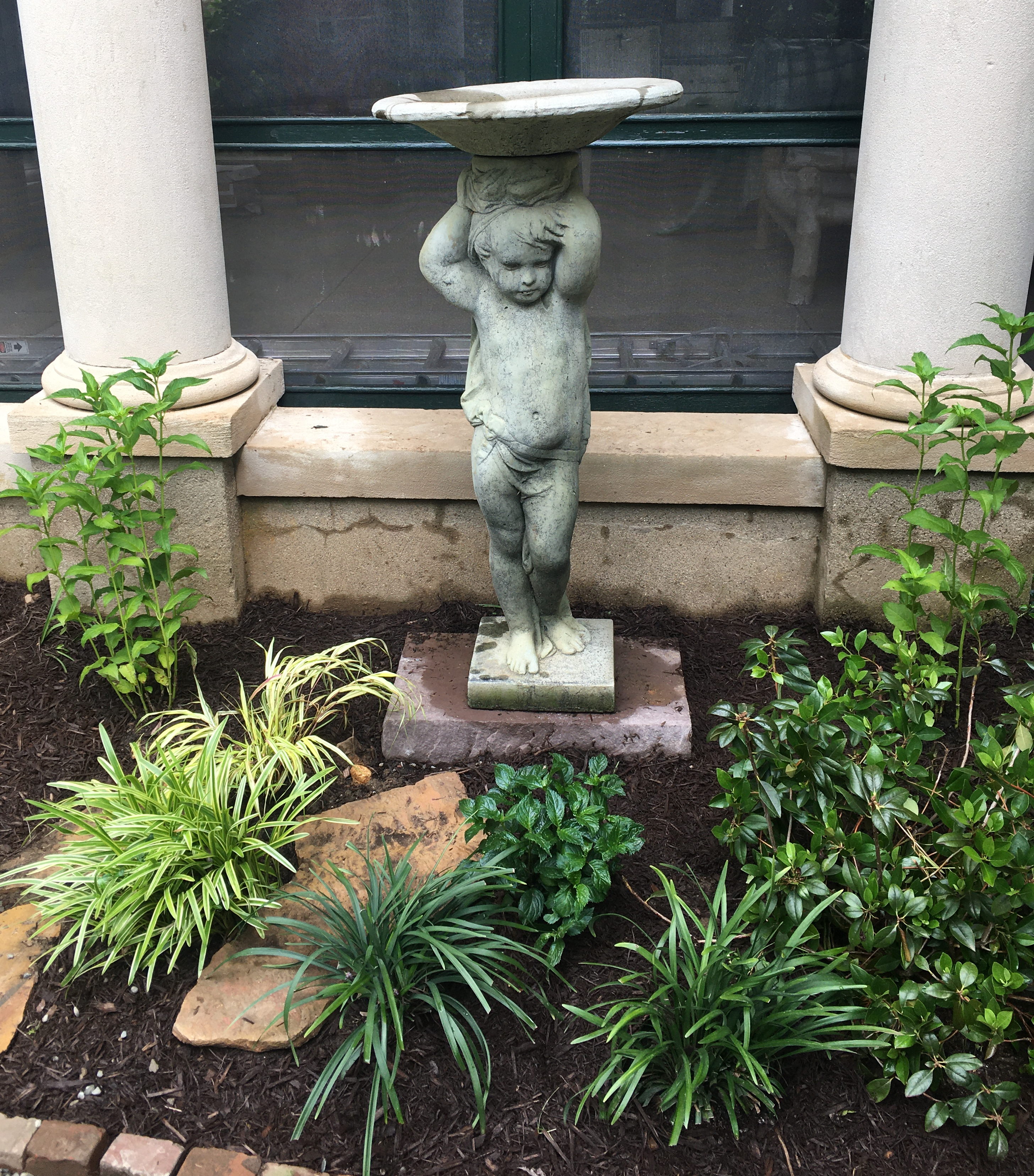 Boy with bird bath statue Florentine garden